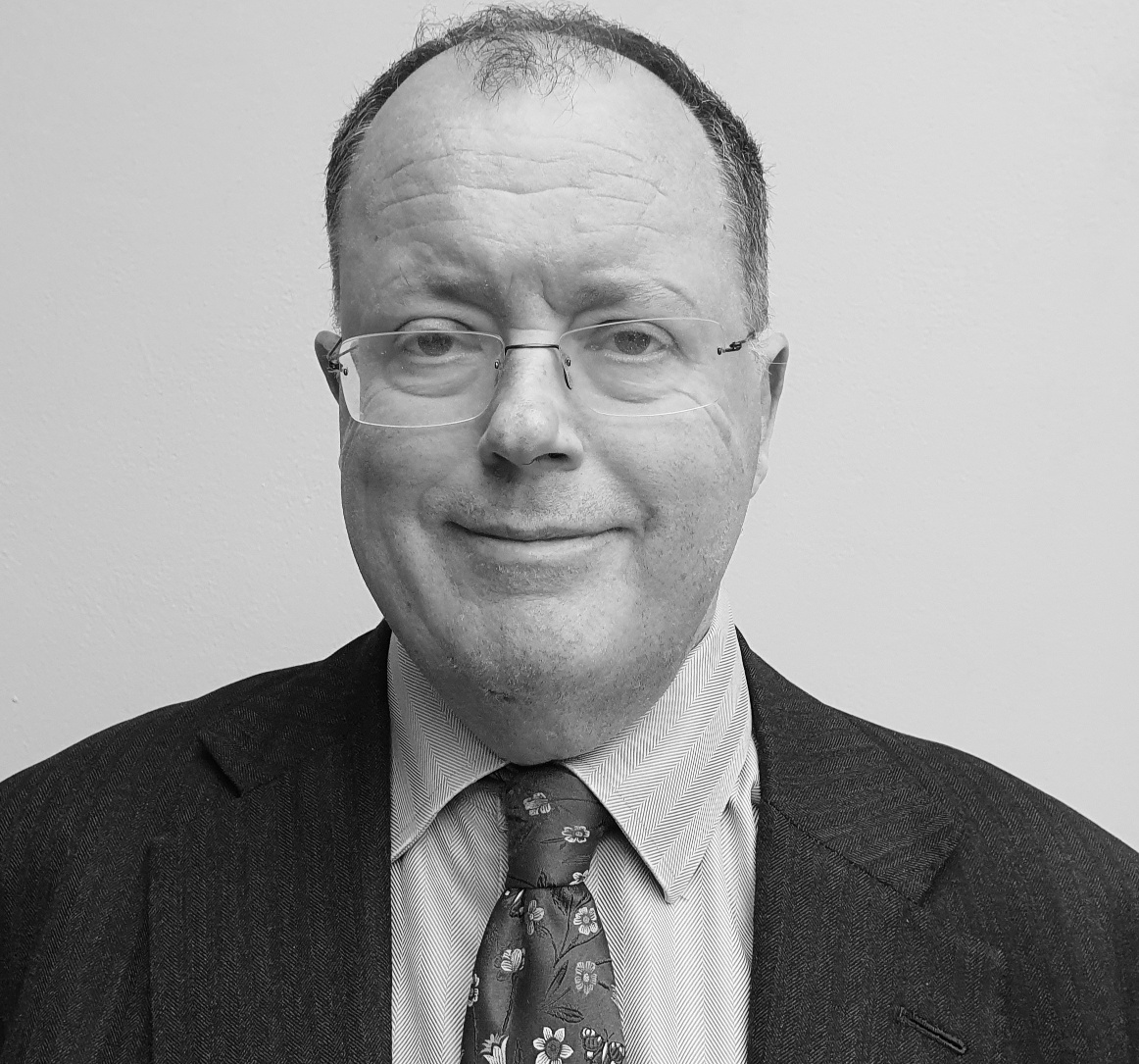 A black-and-white photo of Nicholas Lobbenberg QC.