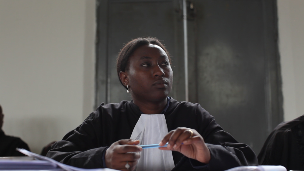 A photo of Amani Kahatwa, a Congolese lawyer, at the Minova trial. A still from The Prosecutors.