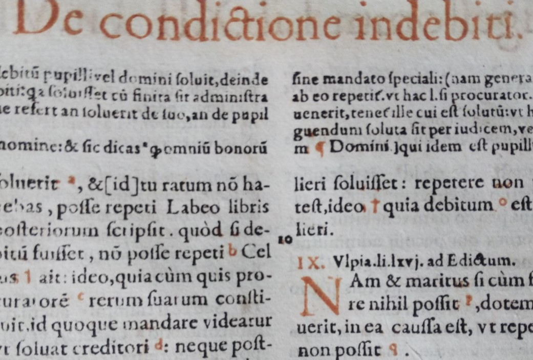 Closeup of early modern Latin law text book.
